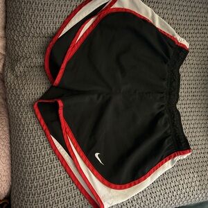 Nike Black and Red Athletic Shorts with Curved Hem
